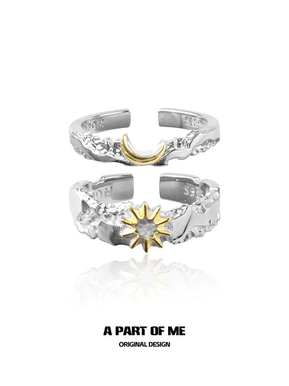 Silver sun and moon couple rings featuring a gold crescent moon and a gold sun design