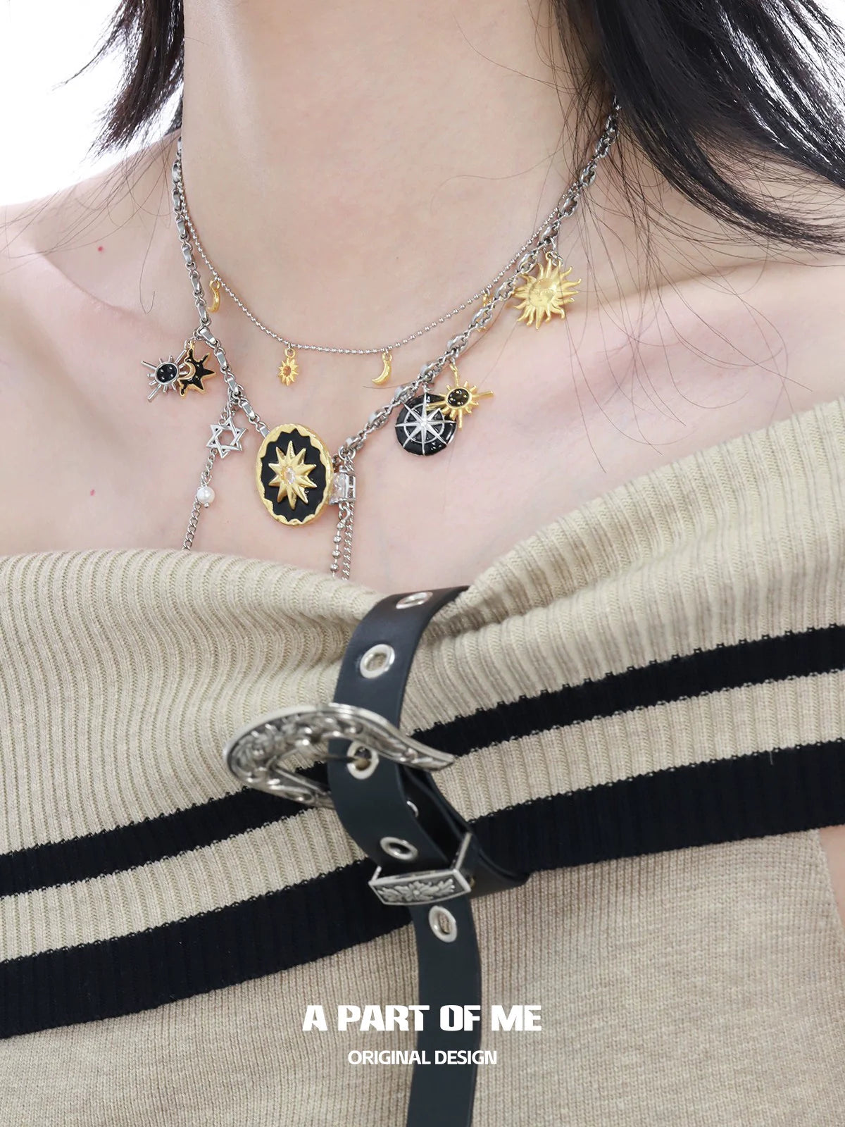 Layered sun and moon necklace with celestial charms for a unique and stylish look