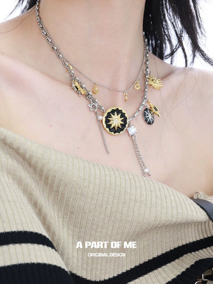 Layered silver sun and moon necklace featuring celestial charms and star details for a stylish look