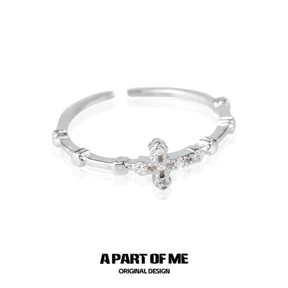 Textured cross silver ring featuring a delicate design with sparkling accents for a unique look