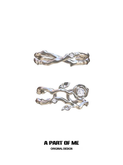 Thorned rose silver ring featuring intricate floral design and sparkling gemstones