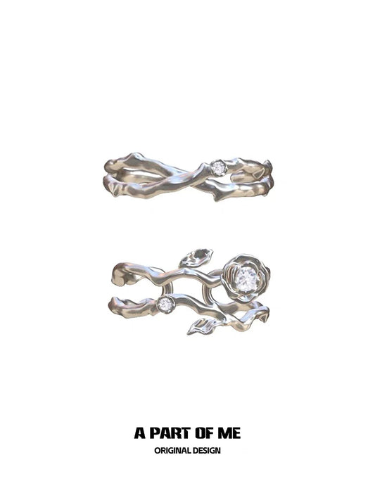 Thorned rose silver ring featuring intricate floral design and sparkling gemstones