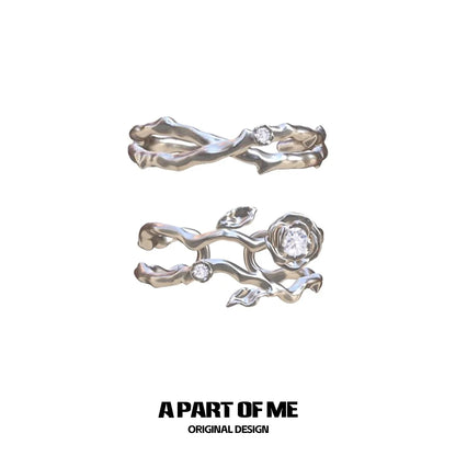 Thorned rose silver ring featuring an intricate design with floral accents and sparkling stones