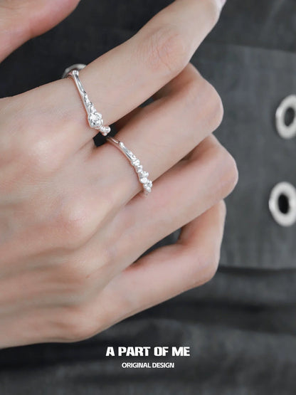A Part of Me unique silver textured ring displayed on fingers with a stylish outfit