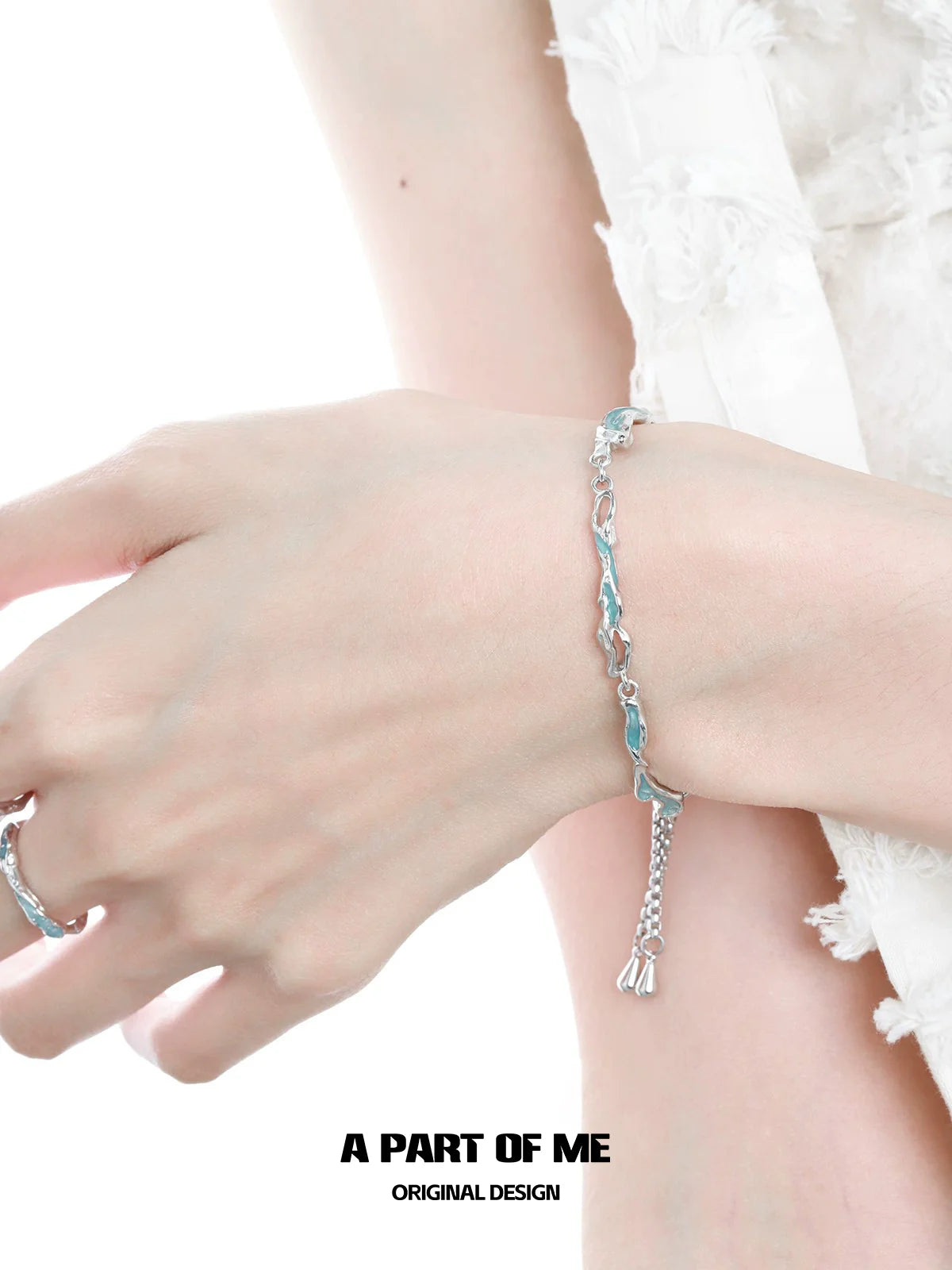 Elegant silver bracelet featuring wavy links designed by A PART OF ME with a touch of sophistication