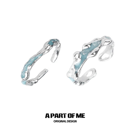 Unique silver design ring with turquoise accents, featuring the white orchid love ring style