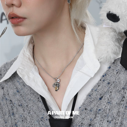 Stylish working puppy necklace featuring a cute puppy charm and intricate design by A PART OF ME