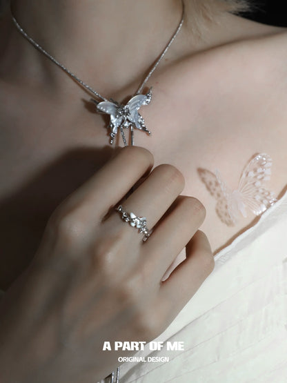 Elegant agate butterfly silver ring showcased on a hand, complementing a butterfly necklace