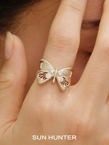 Elegant SUN HUNTER angel butterfly ring in gold with intricate detailing, perfect for stylish accessories