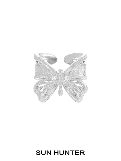 Elegant SUN HUNTER angel butterfly ring in silver featuring intricate detailing and a stylish design