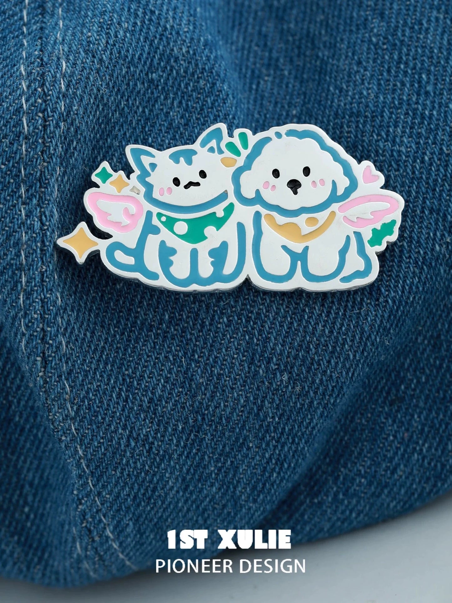 Adorable angel cat and dog brooch featuring cute designs on a denim background