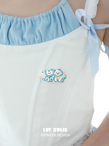 Angel cat and dog brooch on a light blue and white ruffled dress, perfect for cute outfit accents
