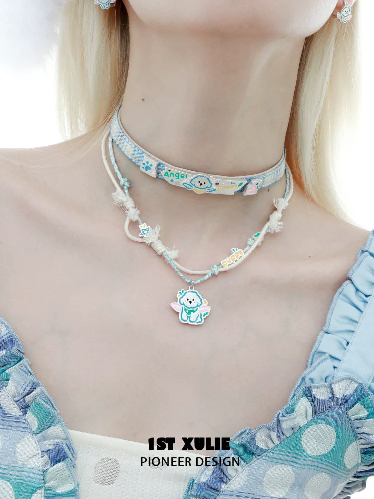 Trendy angel cat and puppy necklace layered with colorful accents for a whimsical look
