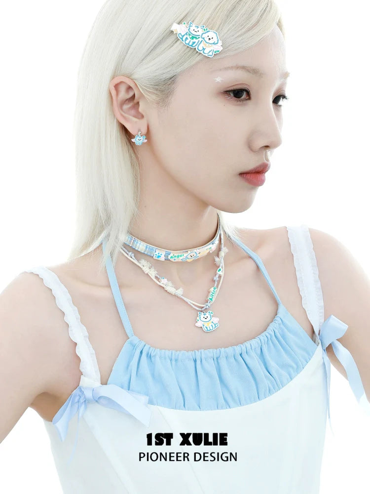 Model showcasing 1STXULIE angel cat and puppy necklace with matching accessories and pastel outfit