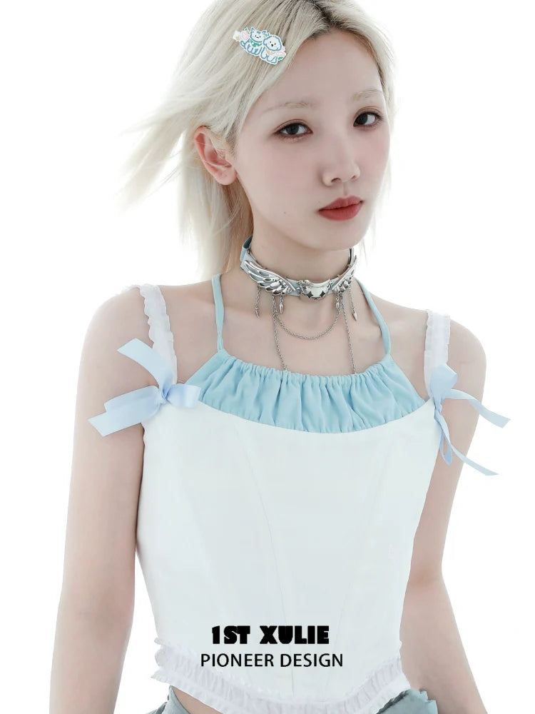 Trendy 1ST XULIE Angel Cat Necklace styled with a light blue crop top and layered accessories