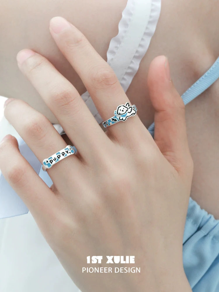 Cute angel kitty puppy silver ring on a model's finger showcasing playful design and detail