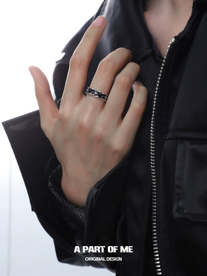 A Part of Me black star cluster ring shown on a model's hand with stylish outfit