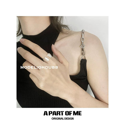 Cliff crack silver ring worn on hand with a stylish black top for a trendy look