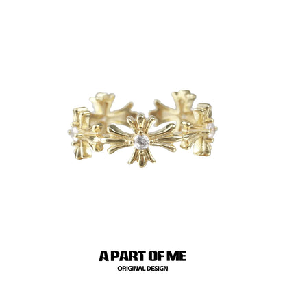A PART OF ME Gold Cross Couple Rings with Intricate Floral Design and Center Gemstone