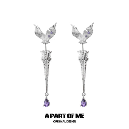 A PART OF ME fishtail dart sword earrings featuring intricate design and amethyst accents