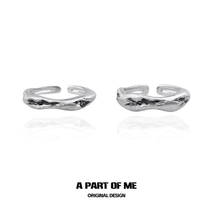 Handcrafted silver geometric couple rings designed by A PART OF ME in an elegant style