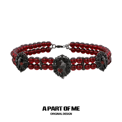 Gothic raven necklace featuring red beads and intricate raven designs for a bold accessory