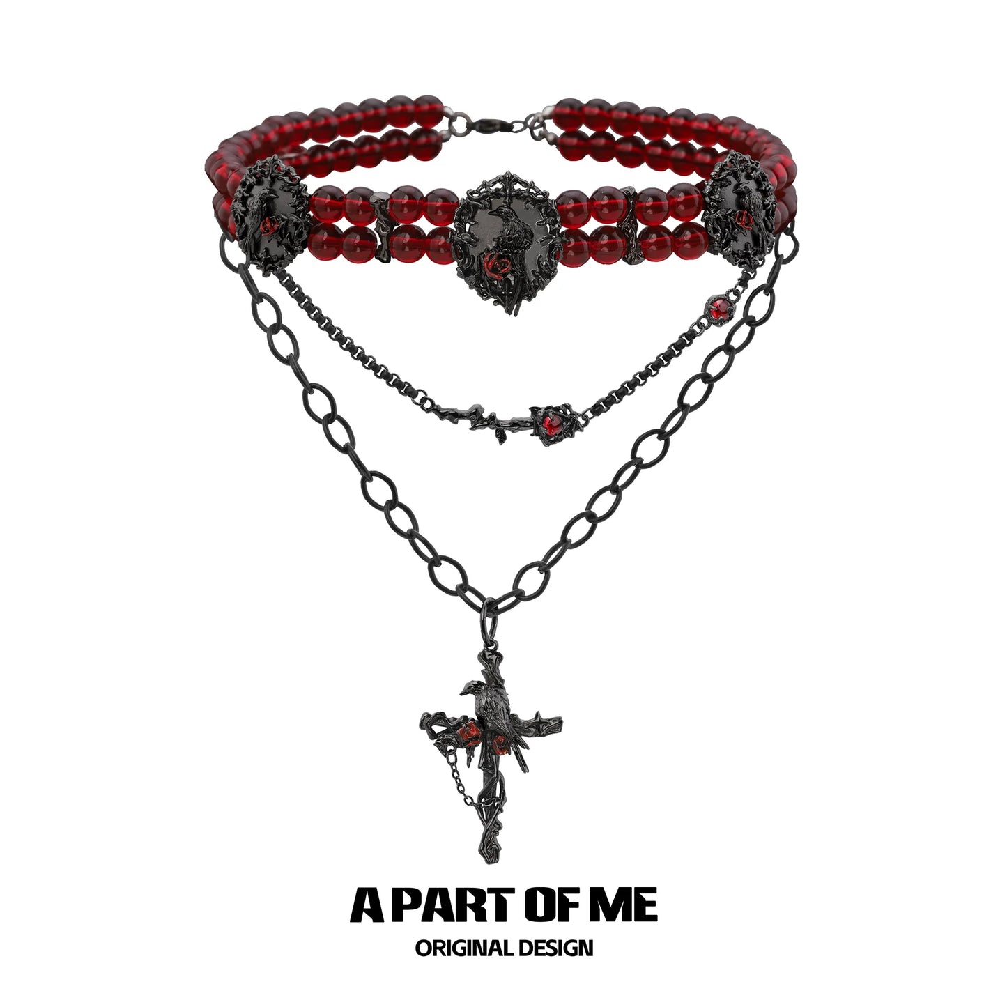 Gothic raven necklace featuring red beads and intricate black chain design from A PART OF ME