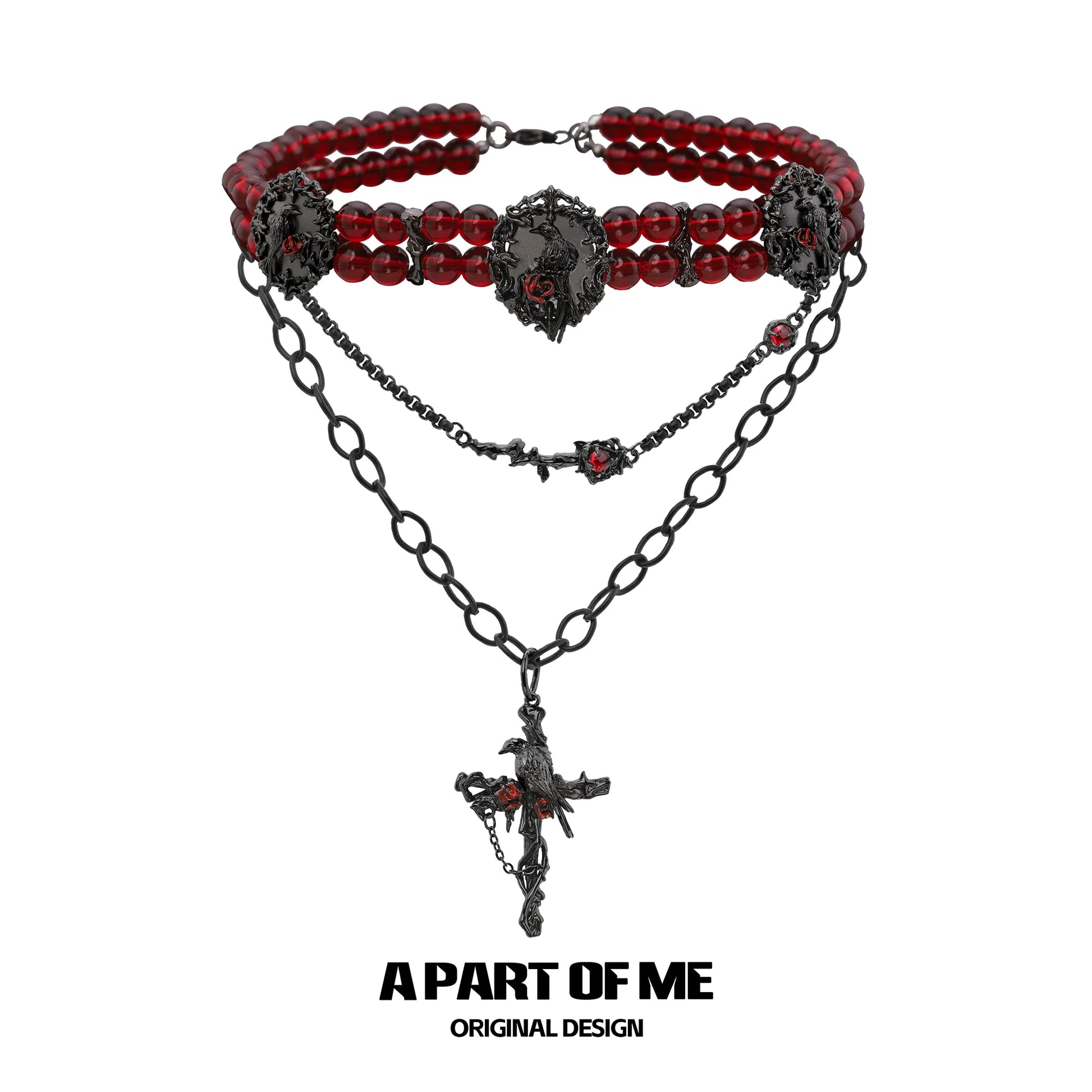 Gothic raven necklace featuring red beads and intricate black chain design from A PART OF ME