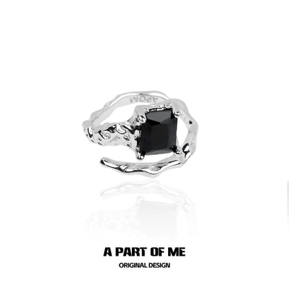 A PART OF ME Midnight Gem Couple Rings featuring a unique silver design with a black gem