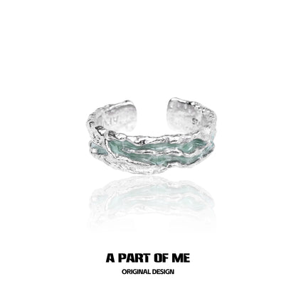 Mint silver ring by A PART OF ME featuring a textured design and unique color accents