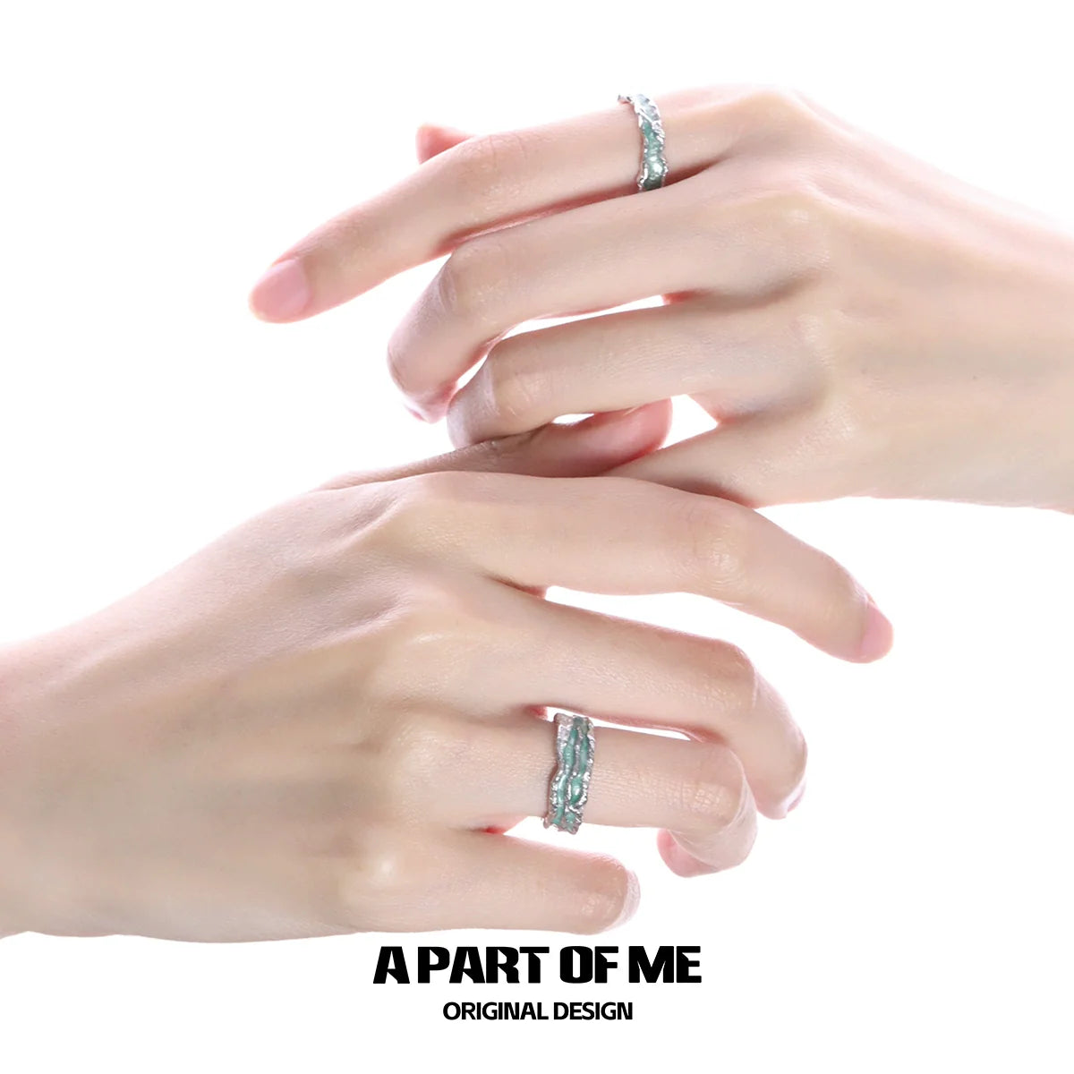 A mint silver ring elegantly displayed on two hands showcasing its unique design and polished finish