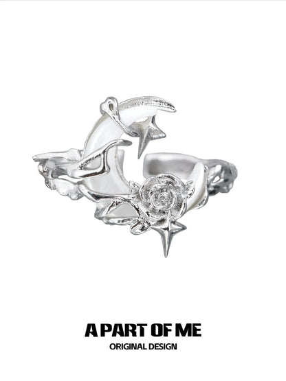 A beautiful moonlight rose silver ring featuring intricate star and rose designs