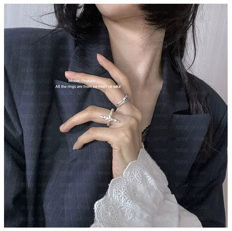 Model wearing A PART OF ME rings including a redemption cross silver ring on her hand