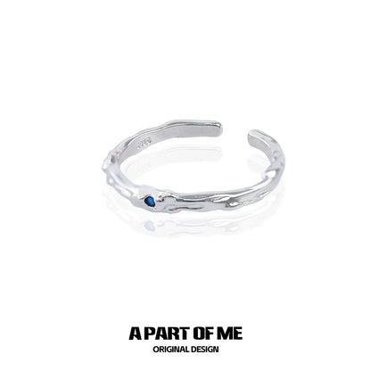 A PART OF ME ultra-fine zircon pair rings featuring a sleek design with a blue accent stone