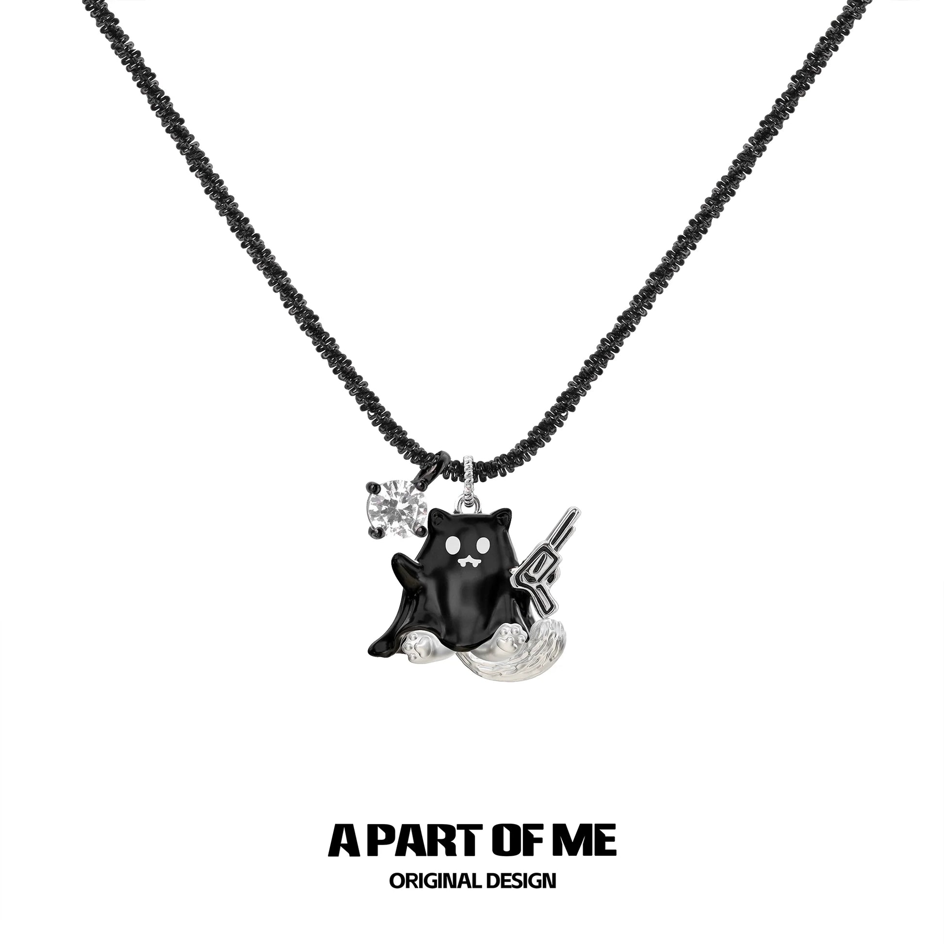 Weapon kitten devil necklace by A PART OF ME featuring a black kitten charm with a gun and sparkling detail