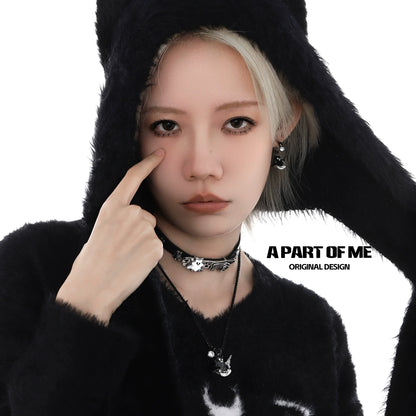 A PART OF ME weapon kitten devil necklace showcased on model, highlighting its unique design