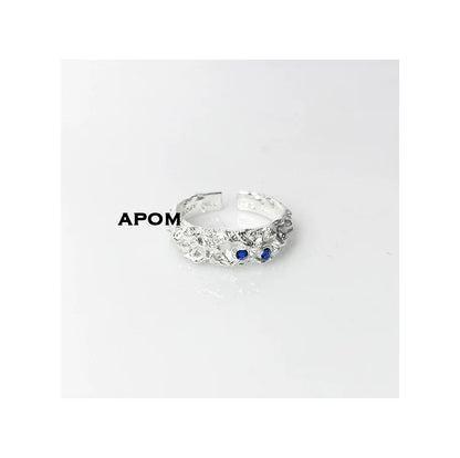 A Part of Me blue gemstone silver ring with intricate design and two blue stones