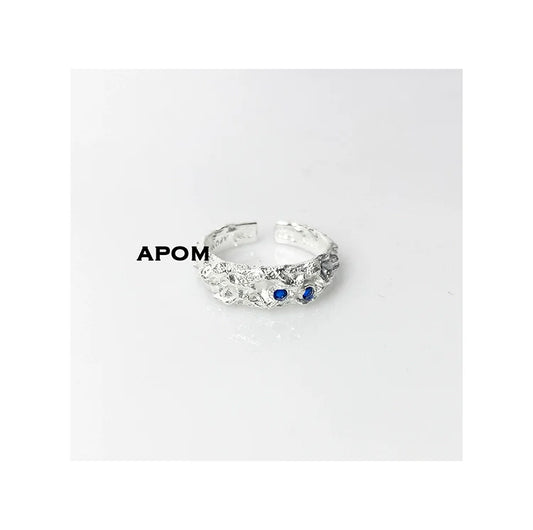 A Part of Me blue gemstone silver ring with intricate design and two blue stones