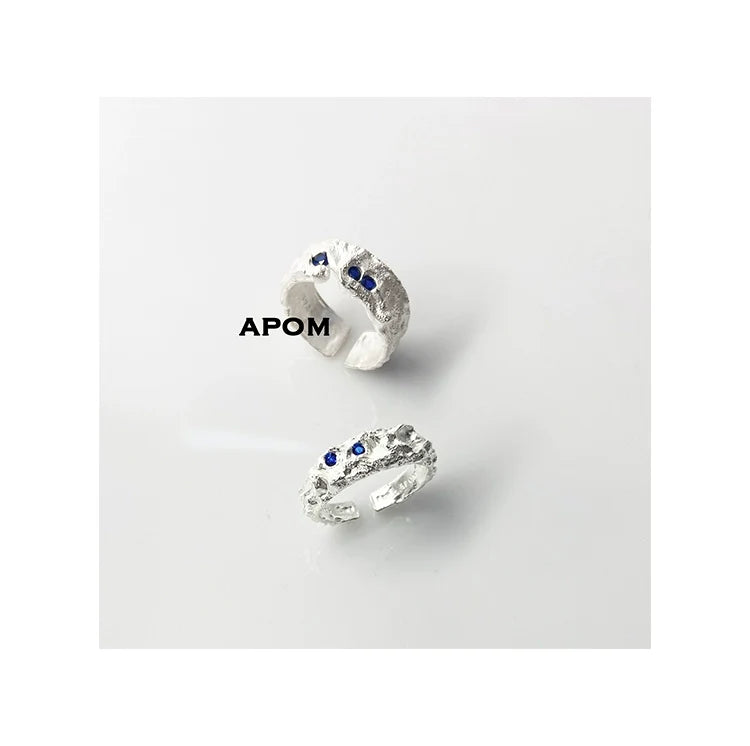 A PART OF ME blue gemstone silver ring featuring a textured band and blue stone accents