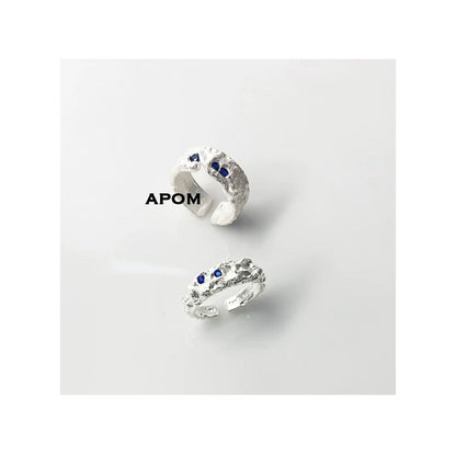 A PART OF ME blue gemstone silver ring featuring a textured band and blue stone accents