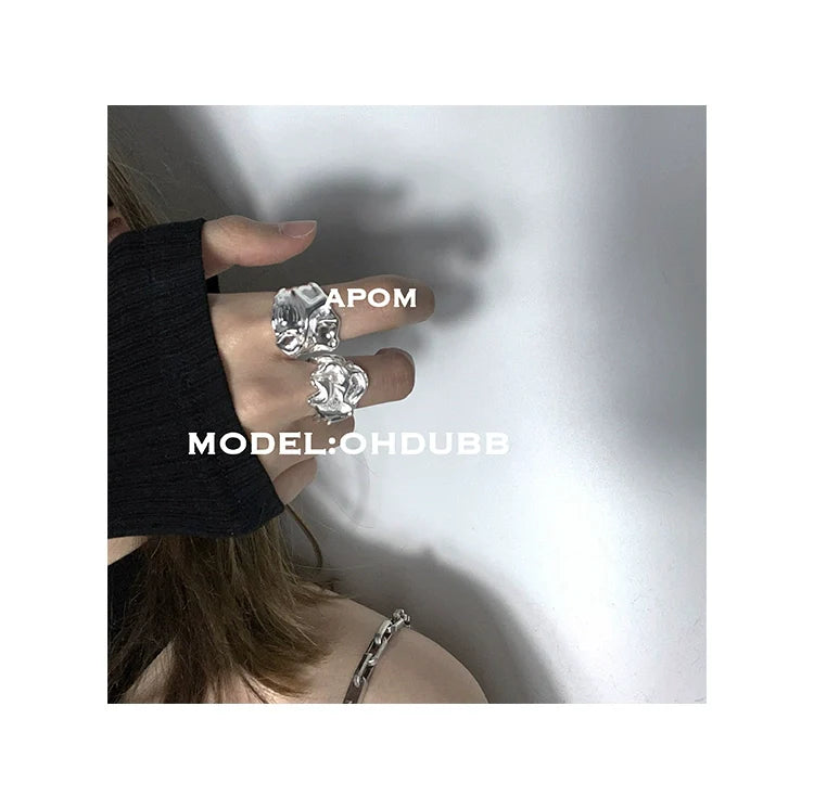 Stylish lace pleated silver ring shown on a model's hand for a trendy look