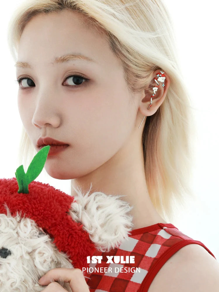 Stylish 1STXULIE apple cat dog ear piercing jewelry showcased on a model with a plush toy