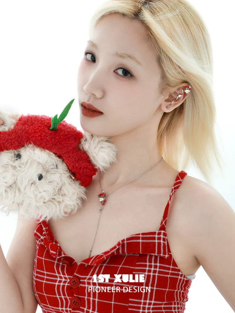 1STXULIE Apple Cat Dog Necklace worn by model in red checkered dress, holding a plush toy