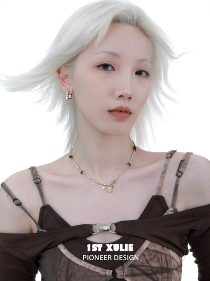 Chic model wearing an autumn butterfly pendant necklace with stylish attire and subtle accessories