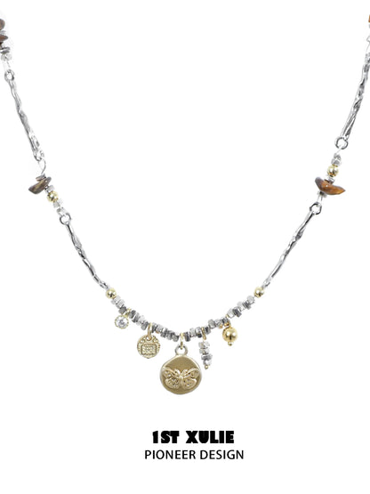 Autumn butterfly pendant necklace with decorative charms and mixed materials for a stylish look