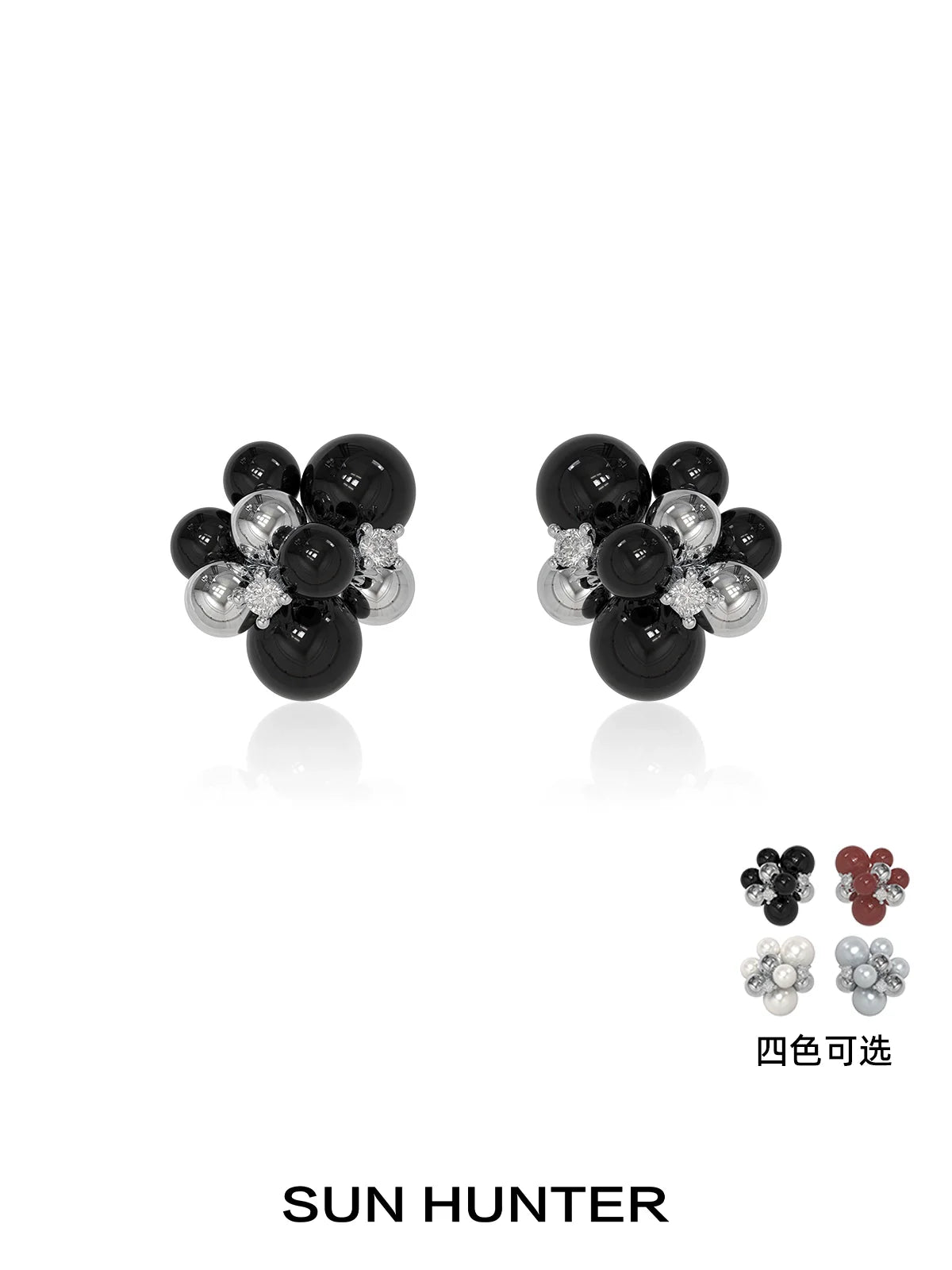 SUN HUNTER black agate earrings with a flower design featuring silver accents