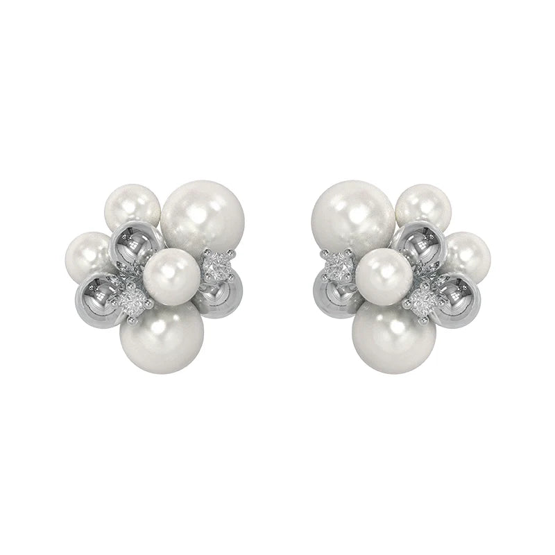 Elegant black agate earrings with a unique design featuring lustrous pearls and silver accents