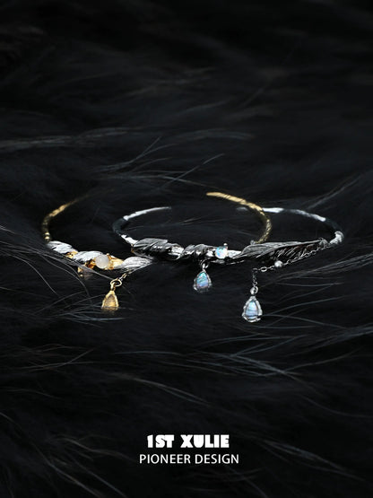 Black and gold feather couple bracelet with delicate design and sparkling charms for couples