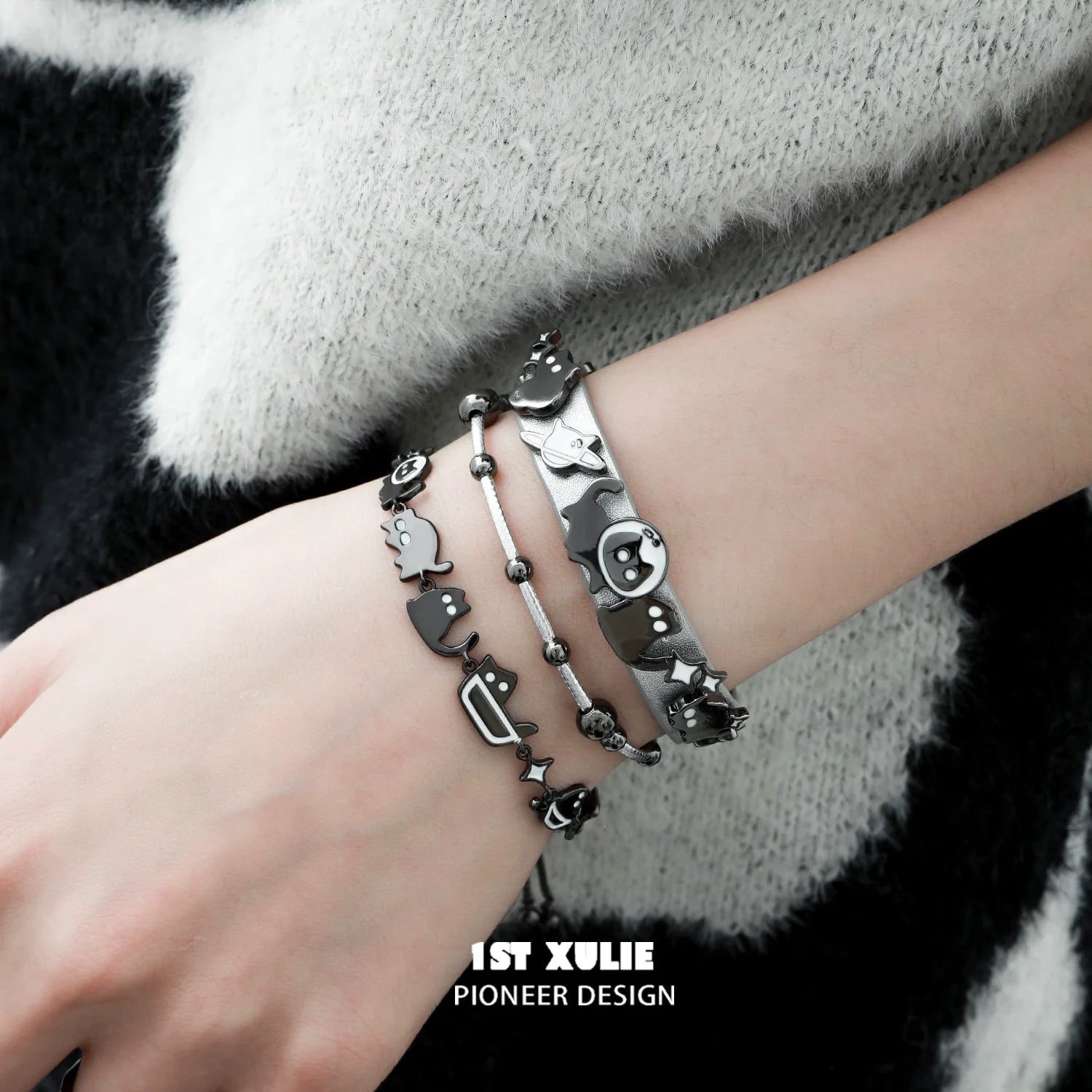 Stylish black cat bracelet set featuring playful cat designs and silver accents for fashion lovers