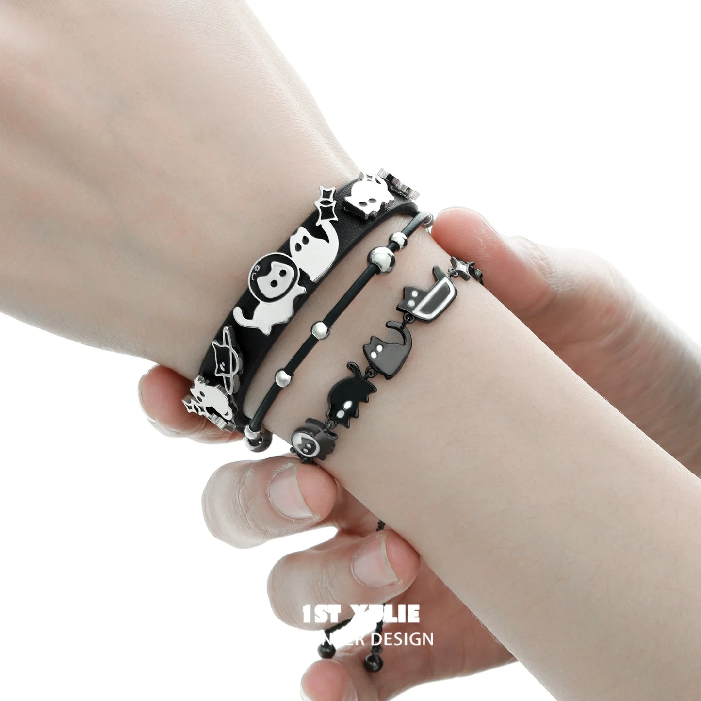 Set of black cat bracelets featuring playful designs and delicate charms for cat lovers